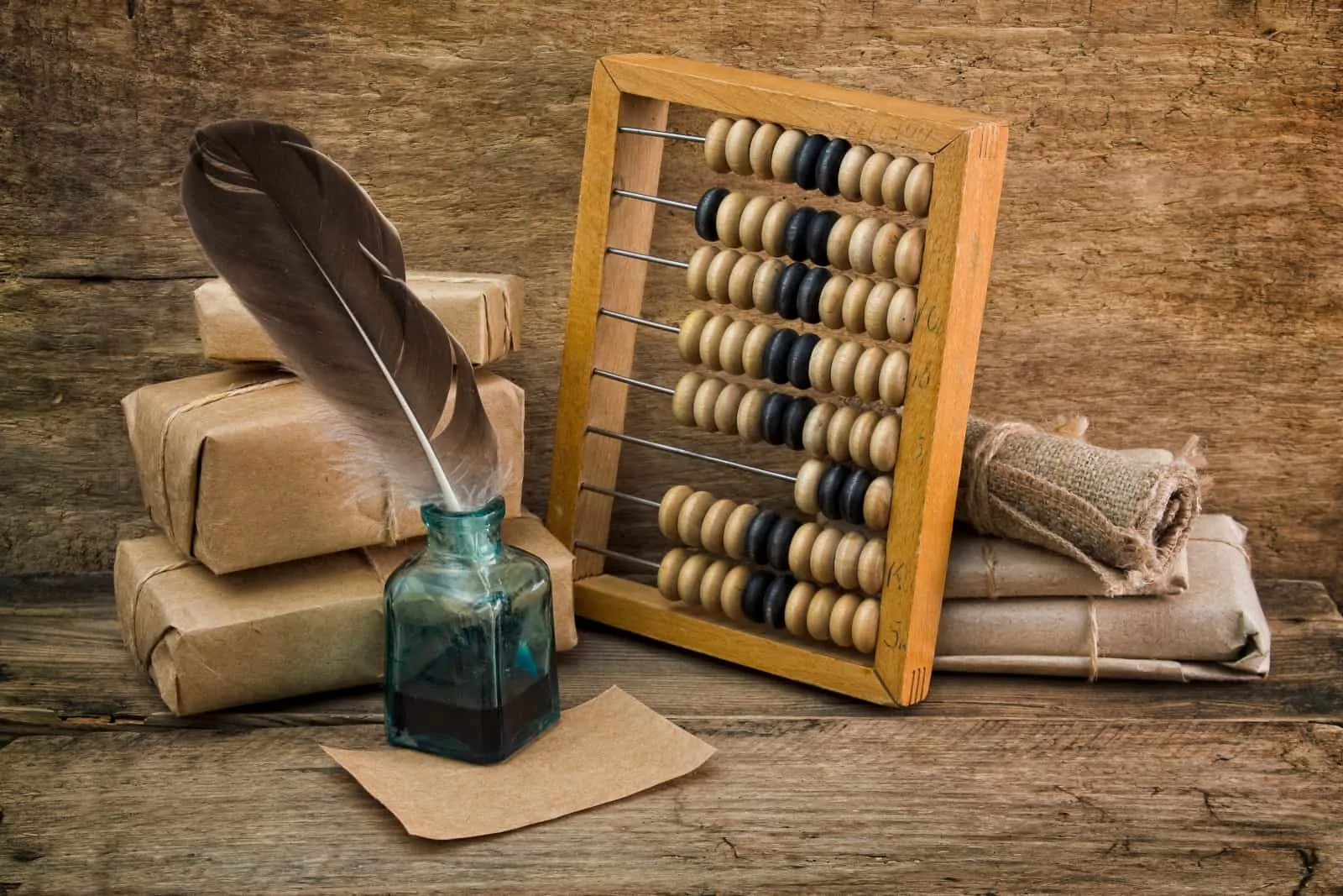 Old-Time Bookkeeping devices: abacus and ink pot + feather quill